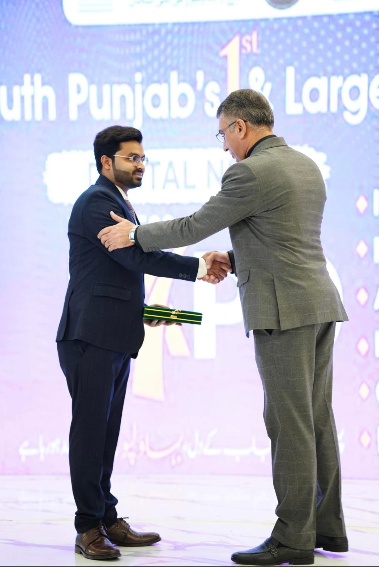 Digital Next representative receives an award at an industry event