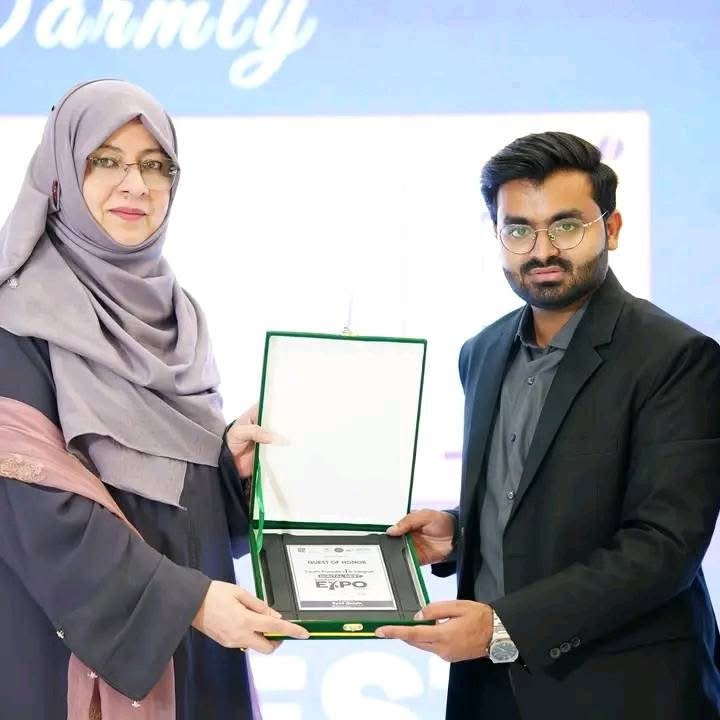 Digital Next representative receives a certificate with an event organizer