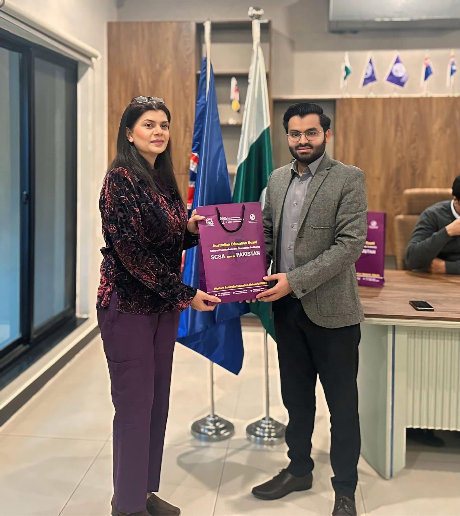 Digital Next representative receives a recognition plaque at an event